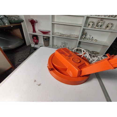 354 - A retro 1960's/70's orange calor 750w portable hair dryer, made in France. Stands at 29cm closed.