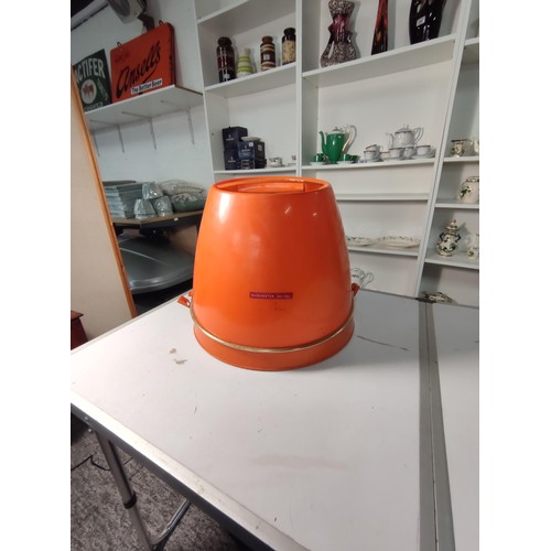 354 - A retro 1960's/70's orange calor 750w portable hair dryer, made in France. Stands at 29cm closed.