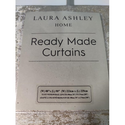 362 - New and sealed Laura Ashley ready made curtains in Evening Gold, in excellent condition with an RRP ... 