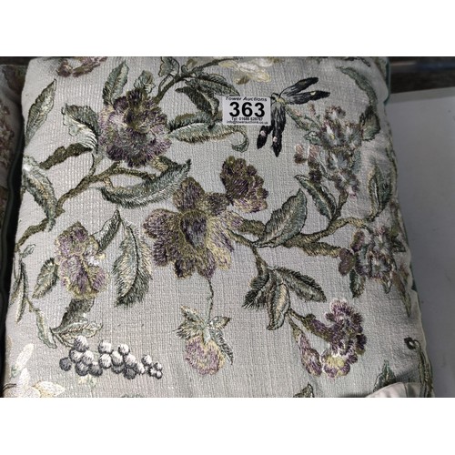 363 - A pair of Laura Ashley Kaylee embroidered scatter cushions in pale duck egg depicting a floral desig... 