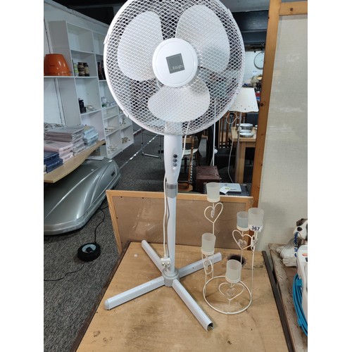 367 - A floor standing electric fan with 3 speed controls along with a 5 division metal tealight holder wi... 