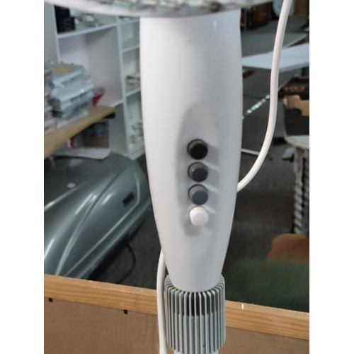 367 - A floor standing electric fan with 3 speed controls along with a 5 division metal tealight holder wi... 