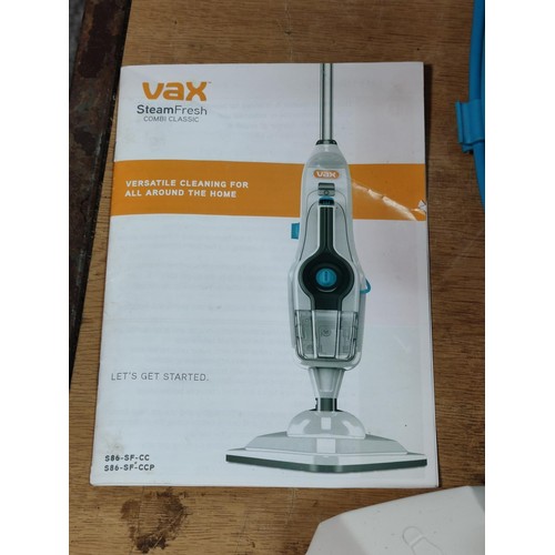 368 - A Vax Steamfresh combi classic steamer complete with a collection of cleaning pads, accessories and ... 