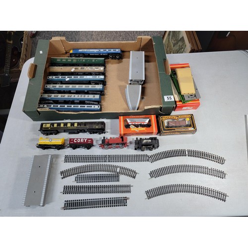 55 - Cardboard tray containing a large quantity of 00 gauge model railway items inc various coaches, boxe... 