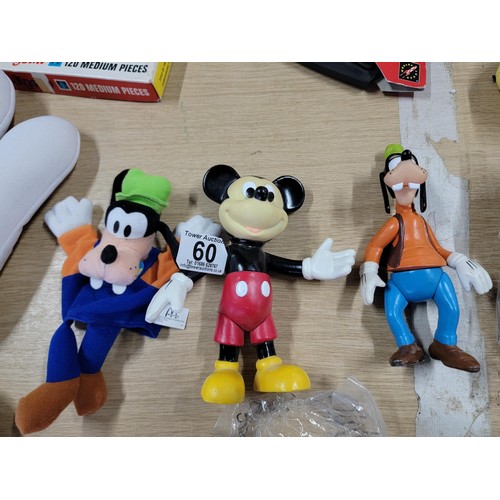 60 - Large collection of Disney related items to include a large pair of mickey mouse gloves, Mickey Mous... 