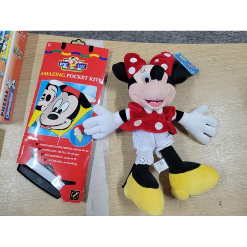 60 - Large collection of Disney related items to include a large pair of mickey mouse gloves, Mickey Mous... 