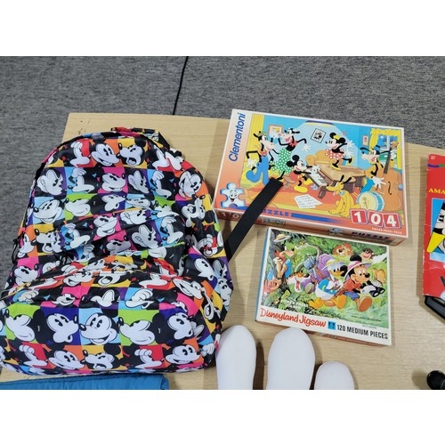 60 - Large collection of Disney related items to include a large pair of mickey mouse gloves, Mickey Mous... 