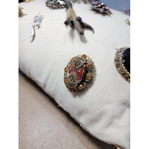 280 - A Russian doll design cushion displaying a quantity of good quality costume jewellery including a de... 