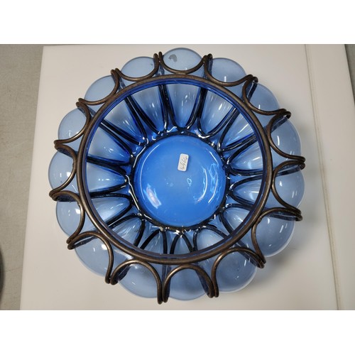 282 - A hand blown Murano blue glass bowl encased in a metal cage, in excellent condition. Height of 9cm, ... 