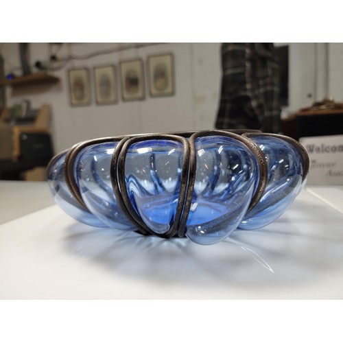 282 - A hand blown Murano blue glass bowl encased in a metal cage, in excellent condition. Height of 9cm, ... 