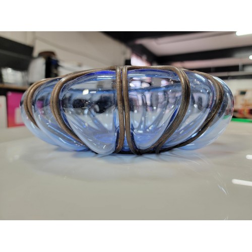 282 - A hand blown Murano blue glass bowl encased in a metal cage, in excellent condition. Height of 9cm, ... 