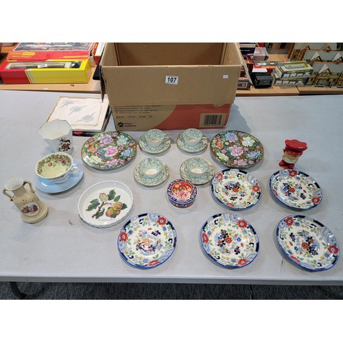 107 - A box containing a quantity of collectable china including a Port Meirion, quiche dish, a pair of ha... 