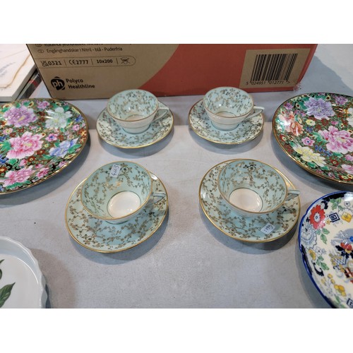 107 - A box containing a quantity of collectable china including a Port Meirion, quiche dish, a pair of ha... 