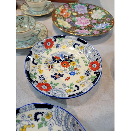 107 - A box containing a quantity of collectable china including a Port Meirion, quiche dish, a pair of ha... 