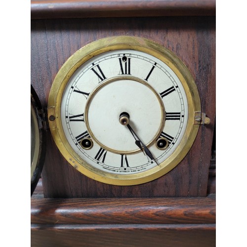 286 - A good quality Ansonia oak mantel clock by Waterbury striking on a bell and coil gong complete with ... 