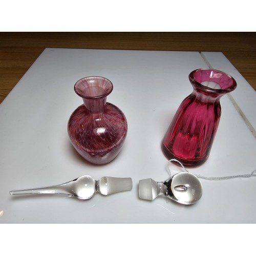 154 - 2x good quality glass scent bottles to include a cranberry glass bottle by Dartington Glass, marked ... 