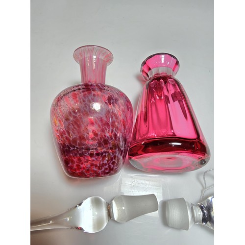 154 - 2x good quality glass scent bottles to include a cranberry glass bottle by Dartington Glass, marked ... 