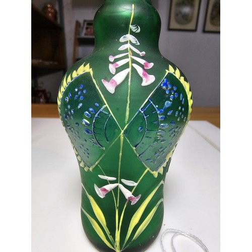 155 - Fine quality green hand painted art glass bottle vase along with a hand painted opaque glass jug. Th... 