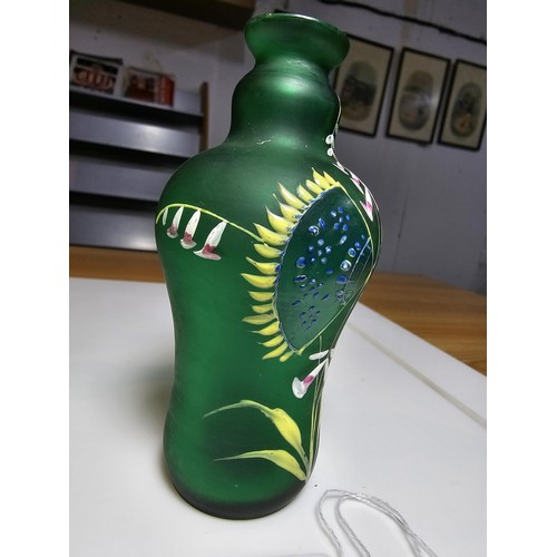 155 - Fine quality green hand painted art glass bottle vase along with a hand painted opaque glass jug. Th... 