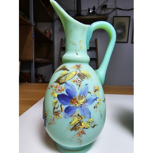 155 - Fine quality green hand painted art glass bottle vase along with a hand painted opaque glass jug. Th... 