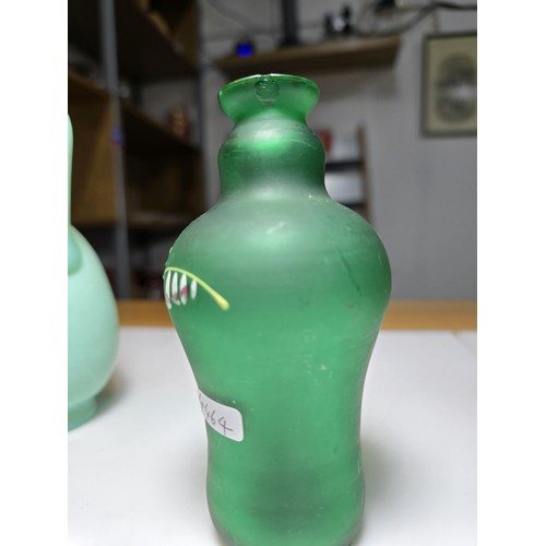 155 - Fine quality green hand painted art glass bottle vase along with a hand painted opaque glass jug. Th... 