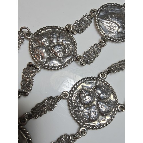 158 - Fine quality hallmarked silver 11 panel link belt with 2x buckle ends featuring ornate embossed scen... 