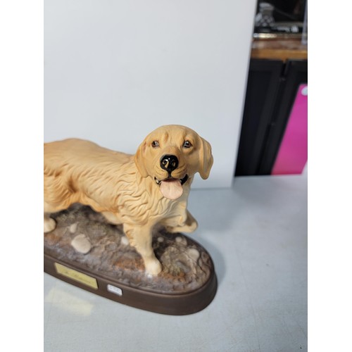 295 - A Beswick golden retriever figure in excellent condition, standing on a ceramic base. Height of 20cm... 