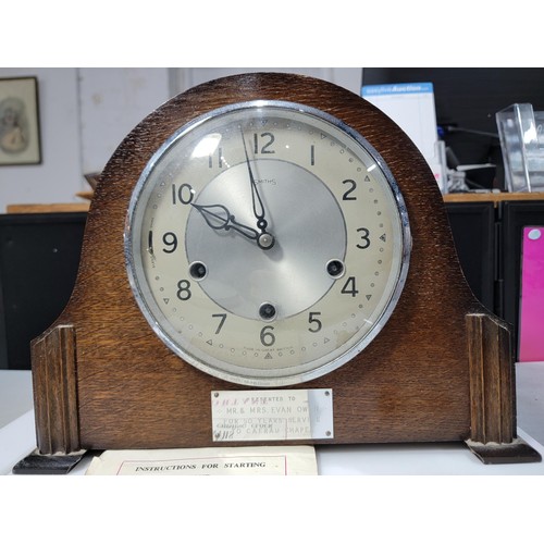 299 - A Smiths oak mantel clock with Westminster chiming and escapement movement, a lovely clean example w... 