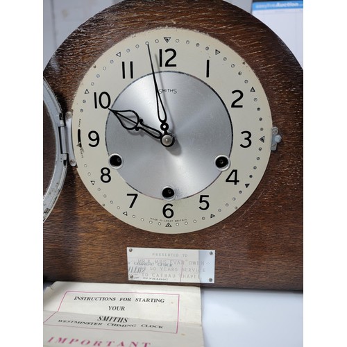 299 - A Smiths oak mantel clock with Westminster chiming and escapement movement, a lovely clean example w... 