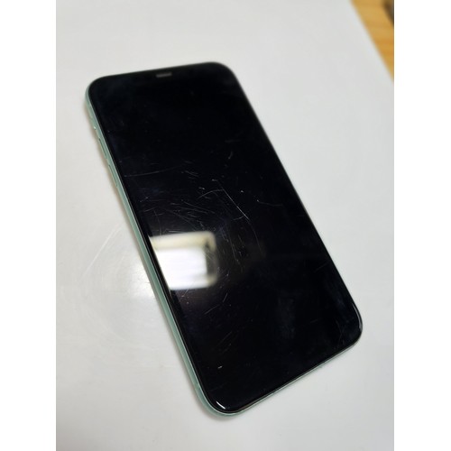 166 - An iphone 11 64gb mobile phone complete with 2x phone cases and an apple charger, phone is in full w... 