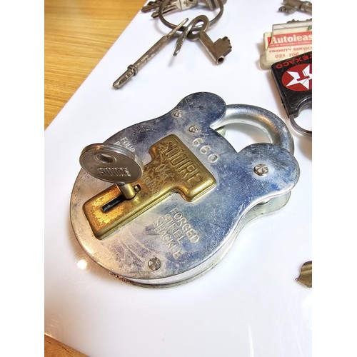 170 - Basket full of various keys to include a squire 660 padlock with its locking key, 2x clock keys alon... 