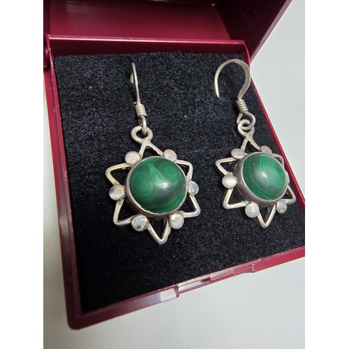 183 - Pair of vintage 925 Silver star formed drop earrings inset with green malachite stones presenting an... 