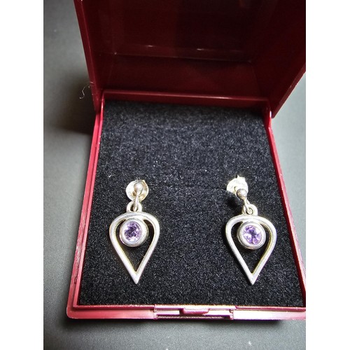 191 - Pair of 925 Silver drop earrings inset with amethyst stones in clean condition - boxed.