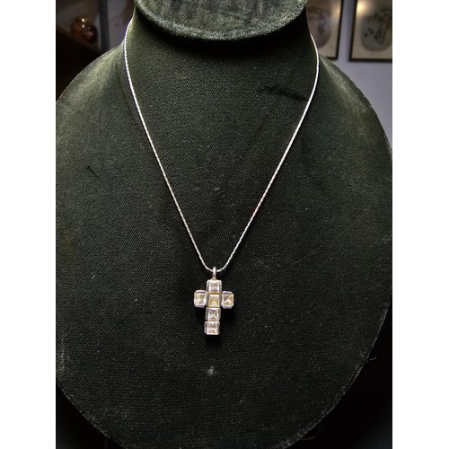 200 - 925 Silver cross pendant inset with crystal CZ stones on a 16 inch 925 Silver chain in clean conditi... 