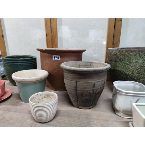 374 - A collection of terracotta plant pots including a 3 graduated set along with a kitchen garden 3 pot ... 