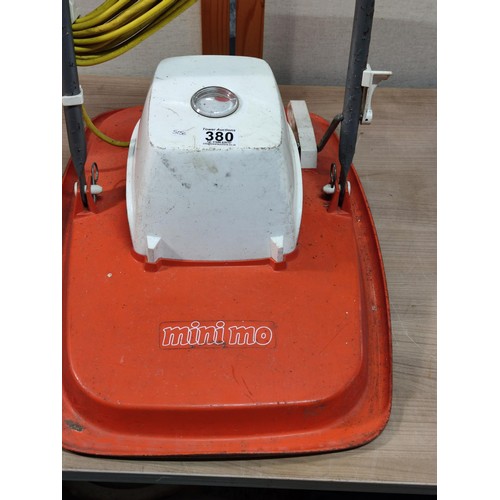 380 - A mini mo electric hover mower complete with blade and folds flat for ease of storage.