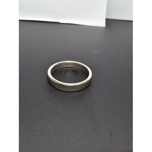 214 - 925 Silver plain band ring - Size K in clean condition - boxed.