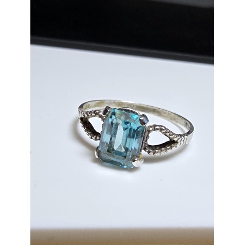 215 - Vintage Sterling Silver art deco ring inset with a large faceted blue Topaz gen stone in clean condi... 