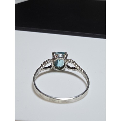 215 - Vintage Sterling Silver art deco ring inset with a large faceted blue Topaz gen stone in clean condi... 