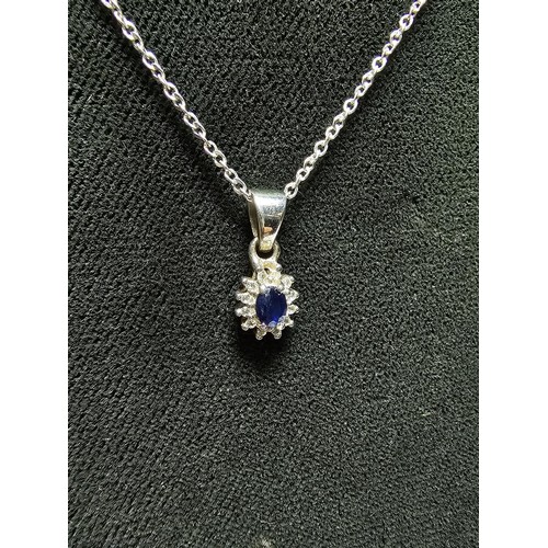 217 - Vintage 925 Silver pendant inset with a blue sapphire gem stone surrounded by clear Topaz stones on ... 