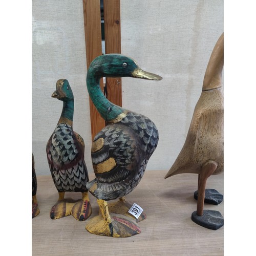 391 - A collection of 6 wooden fairtrade ducks including 3 graduated mallard style ducks. 2 ducks have old... 