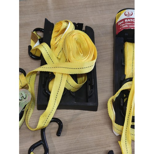 392 - A box containing 4 two piece ratchet tie down sets with 4.5m of ratchet strap along with a quantity ... 