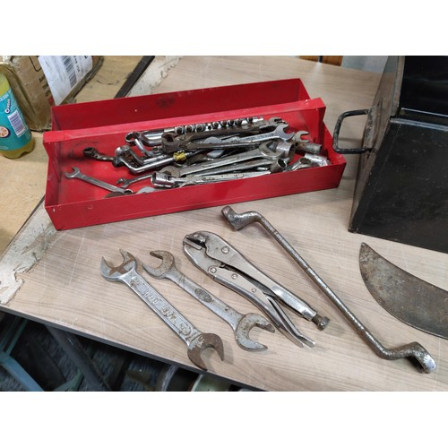 394 - A large metal tool box containing a large quantity of tools including mole grips, files, spanners, a... 