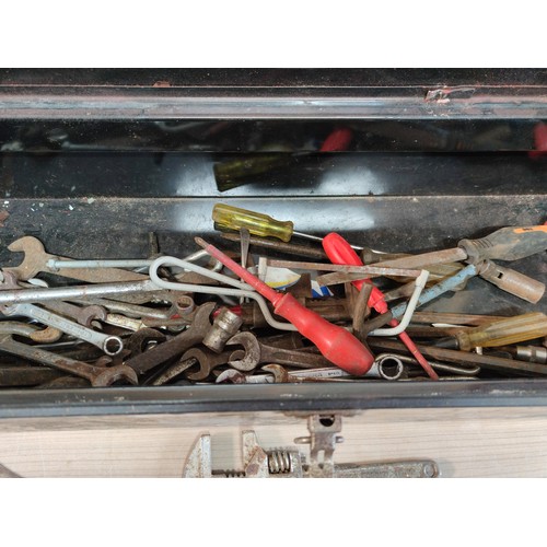 394 - A large metal tool box containing a large quantity of tools including mole grips, files, spanners, a... 