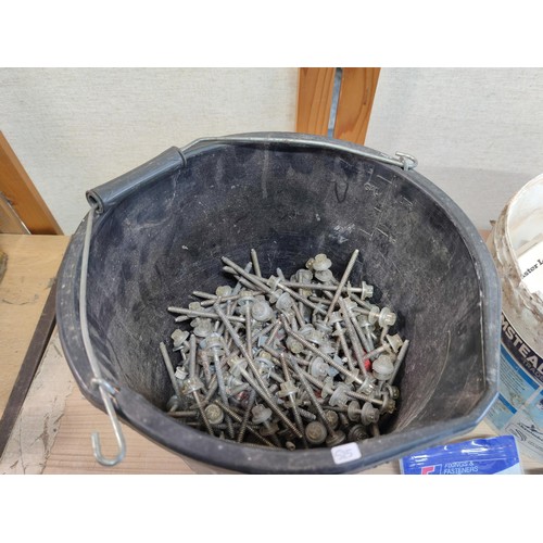 395 - 2 buckets containing a large quantity of various sized nuts screws nails and bolts, some are boxed i... 