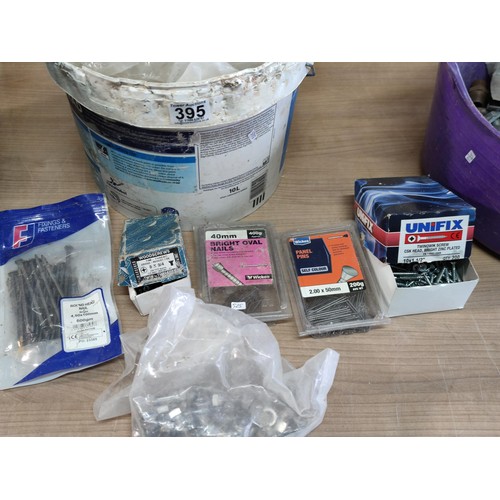 395 - 2 buckets containing a large quantity of various sized nuts screws nails and bolts, some are boxed i... 