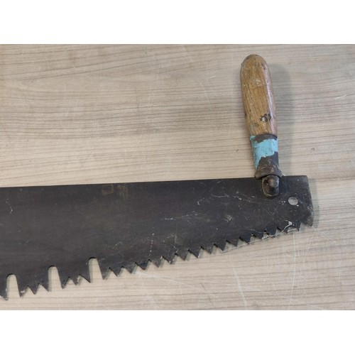 398 - A vintage 2 man wood saw with a good quality blade, blade measures 80cm in length with a weighted ha... 