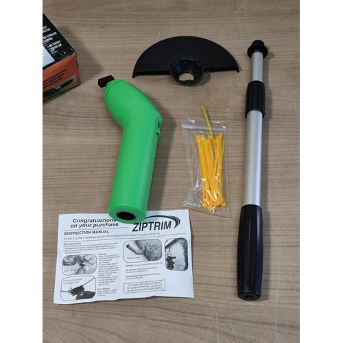 409 - A boxed cordless Ziptrim cordless trimmer for grass cutting, etc. Battery operated.