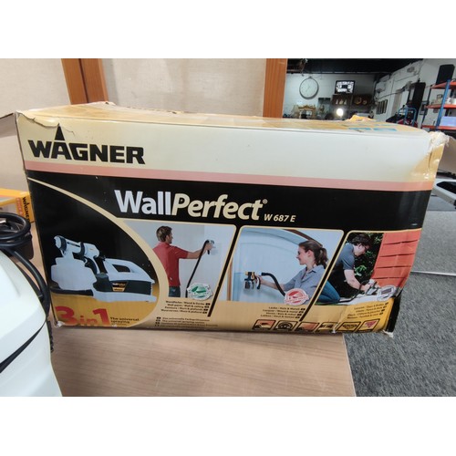 410 - A boxed as new Wagner paint sprayer along with a Wagner handle extension complete with accessories, ... 