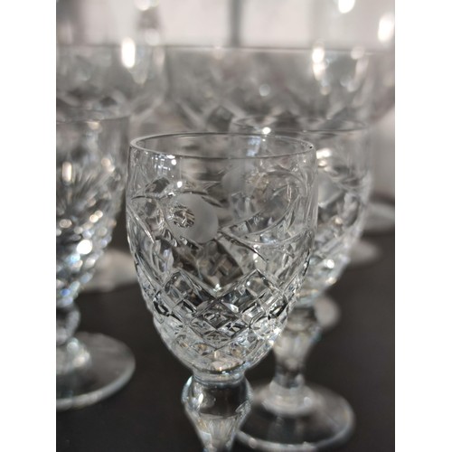 322 - A large quantity of glassware including many matching sets crystal cut etched glass sherry glasses, ... 